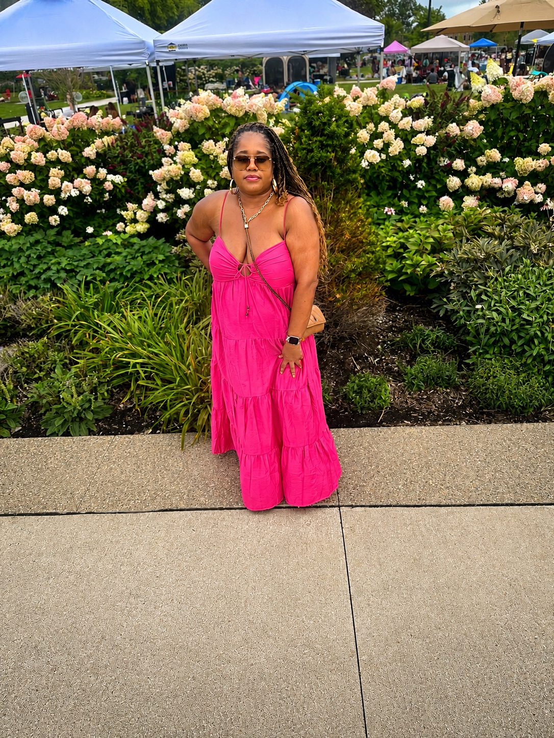 Regina smiling in a bright pink dress at Black Girl Picnic